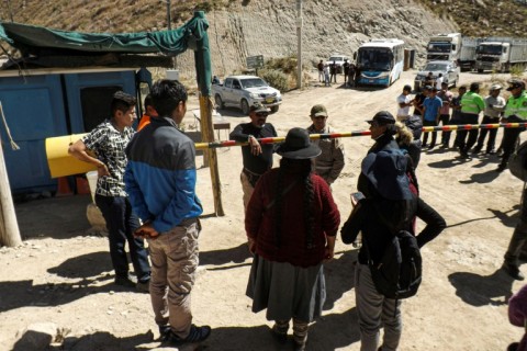 Relatives of miners wait for information at the entrance of the La Esperanza mine, where at least 27 people died following a fire