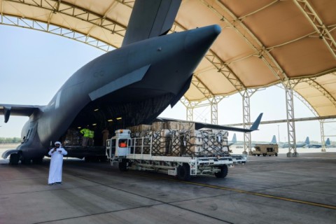 Aid is loaded into a military plane bound for Port Sudan at the Abu Dhabi International Airport 