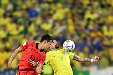 South Korean midfielder Son Jun-ho (L) in action against Brazil at the World Cup