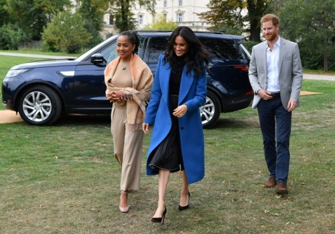 Prince Harry photographed with his wife Meghan and her mother Doria Ragland