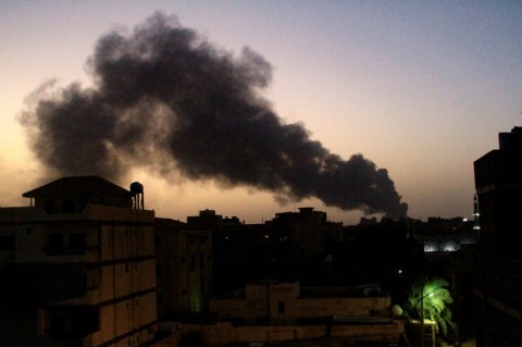 Smoke rises over Khartoum on Friday as air strikes and artillery exchanges grip the Sudanese capital