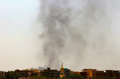 Smoke rises above buildings in war-ravaged Khartoum