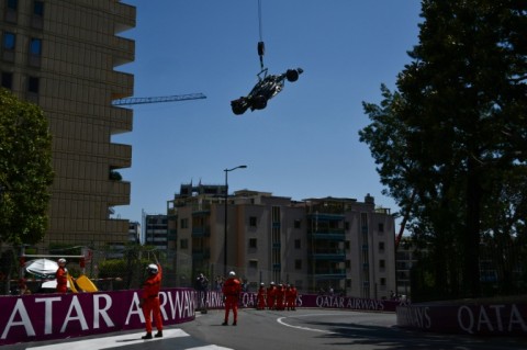 Race marshals remove the car of Mercedes' British driver Lewis Hamilton after he crashed during practice ahead of the Monaco Grand Prix