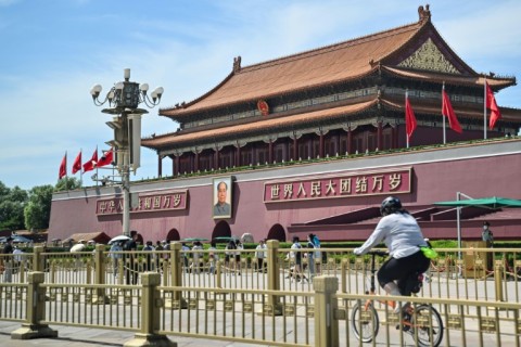 On Sunday, officers were posted around Tiananmen Square, at times stopping cyclists