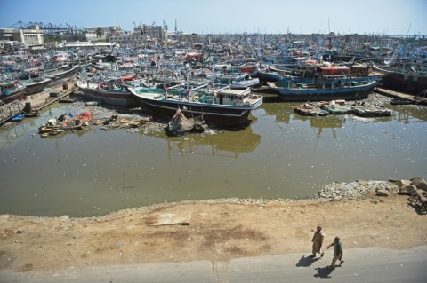 Fishing boats are anchored at a harbour in Karachi, where some people will be evacuated ahead of a cyclone this week