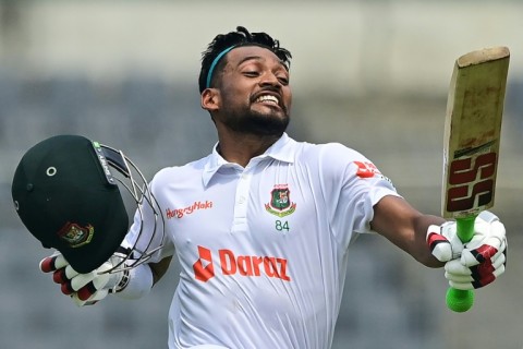 Bangladesh batter Najmul Hossain celebrates after scoring a century on the first day of the one-off Test against Afghanistan at the Sher-e-Bangla National Cricket Stadium in Dhaka