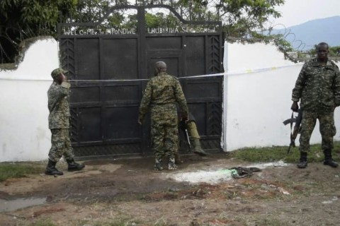 Uganda security forces outside the school premises where the attack took place in Mpondwe