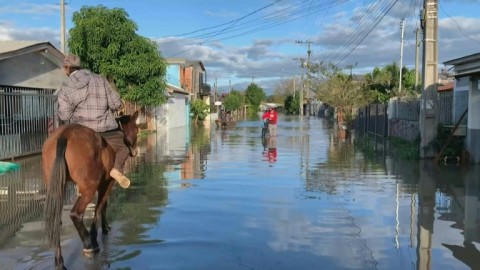 Flooded streets after cyclone leaves 13 dead in southern Brazil