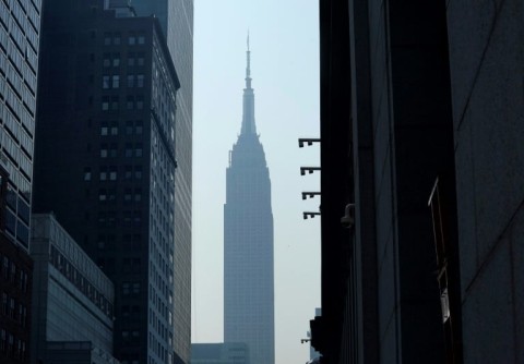 The Empire State Building in New York seen through smoke