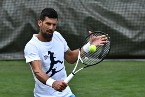 'Hungry' man: Novak Djokovic trains at Wimbledon