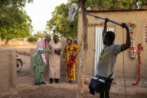 It takes a village: Actors (from left) Rasmane Ouedraogo, Ildevert Meda and Aminata Diallo-Glez on the set of 'Welcome to Kikideni'