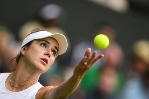 Ukraine's Elina Svitolina serves against Venus Williams at Wimbledon