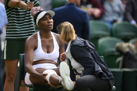 Venus Williams receives medical attention during her Wimbledon first-round match against Ukraine's Elina Svitolina 