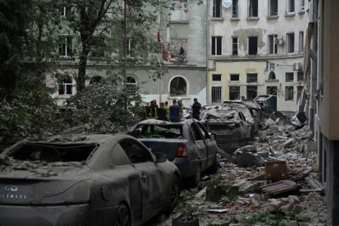 AFP footage showed emergency responders clearing rubble and wood from the gutted first floor of a building in Lviv