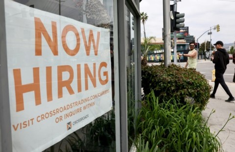 The rate of hiring slowed in the United States last month while wage growth accelerated