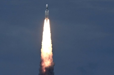 India launched a rocket on Friday carrying an unmanned spacecraft to land on the Moon