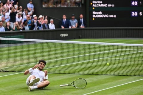 Spain's Carlos Alcaraz celebrates winning Wimbledon 