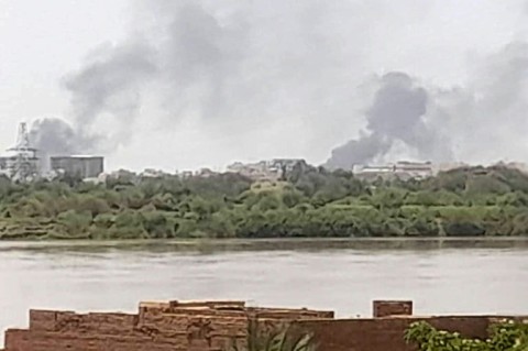 Smoke billows in the distance north of the Khartoum Bahri district amid ongoing fighting on July 14, 2023