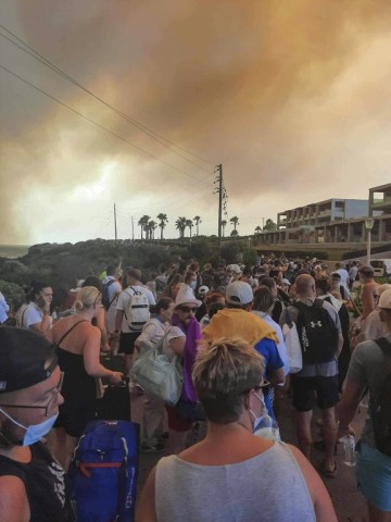 Some tourists were forced to walk to safety after the fires cut off some roads