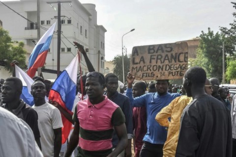 Junta supporters, some holding anti-French slogans and some waving Russian flags, gathered in the capital Niamey