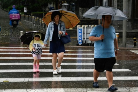 Hundreds of millions of people in northern China, including Beijing, remain under a red alert for heavy rain