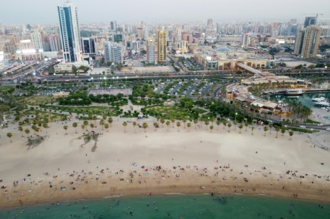 People flock to the beach to escape the heat in Kuwait City on July 7, 2023