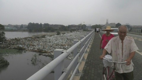 Beijing park engulfed in floodwater and plastic waste