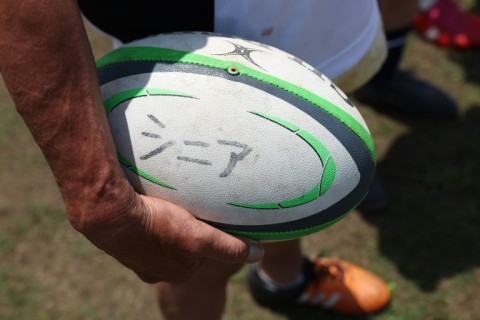 The word 'senior' is inscribed in Japanese on a ball used at an Over-70s training session in Kamakura