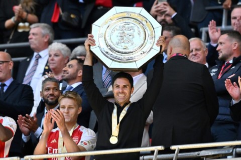 Arsenal manager Mikel Arteta lifts the Community Shield trophy