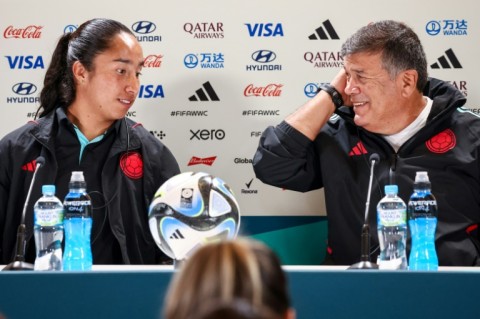 Colombia coach Nelson Abadia and player Mayra Ramirez talk to the media