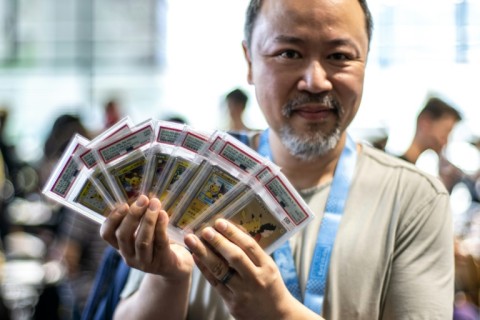 Pokemon fan Jeffrey Ng shows off some of his collection in the dedicated trade area at the 2023 Pokemon World Championships