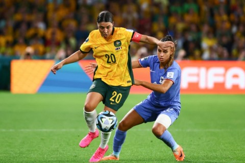 Sam Kerr holds off French defender Maelle Lakrar after coming on as a second-half substitute