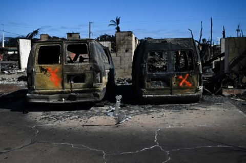 Spray-painted Xs marked vehicles that lay in the street -- a sign to firefighters they have been checked for victims