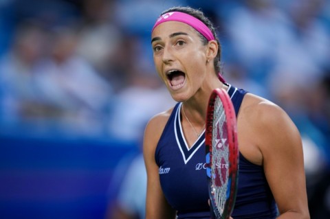 Defending champion Carolina Garcia reacts on her way to defeat against Sloane Stephens
