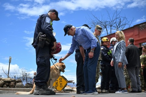 Biden met some of the search and rescue teams that are hunting for victims of the wildfire