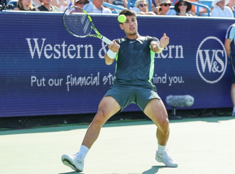 Carlos Alcaraz scrambles for a forehand in his loss to Novak Djokovic in the final of the ATP Cincinnati Open