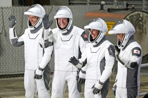 (From L) Konstantin Borisov, Andreas Mogensen, Jasmin Moghbeli and Satoshi Furukawa,  wearing SpaceX spacesuits, wave before they depart for the ISS