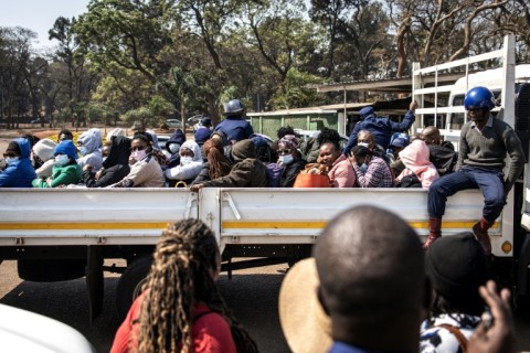 Three dozen local election observers were arrested, crammed into a truck and shipped off to a Harare court