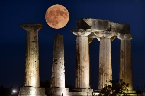 The "Blue Supermoon", the second full moon of a calendar month, rises above the Apollo Temple in ancient Corinth, on August 30, 2023