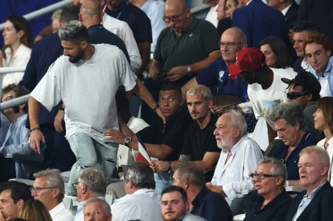 France's World Cup winners from another sport -- Olivier Giroud (L) Kylian Mbappe (C) and Antoine Griezmann (R) -- were among the crowd at the Stade de France for the Rugby World Cup opener