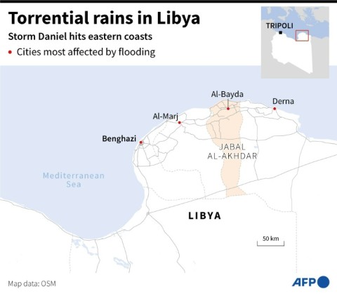 People look at the damage caused by freak floods in Derna, eastern Libya