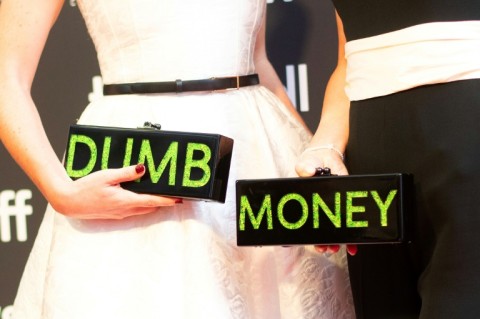 Executive producers and writers Rebecca Angelo (L) and Lauren Schuker Blum (R) repped their film 'Dumb Money' with their handbags at the Toronto premiere 