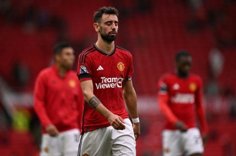 A dejected Bruno Fernandes leaves the pitch at Old Trafford after the 3-1 defeat by Brighton