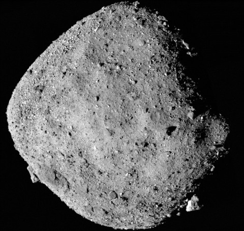 This image from a NASA video shows the robot arm of the Osiris-Rex probe collecting samples from the asteroid Bennu on October 21, 2020