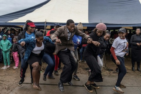 Supporters of an opposition candidate dance during a gathering in Siphofafeni on Wednesday