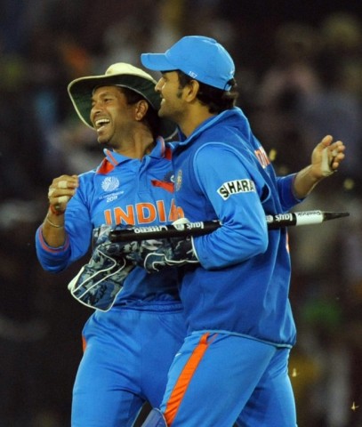 Moment of victory: India's Sachin Tendulkar and Mahendra Singh Dhoni celebrate victory in the 2011 World Cup match against Pakistan in Mohali 