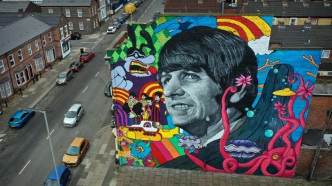 A mural featuring Ringo Starr painted by Liverpool artist John Culshaw on the facade of The Empress Pub in Toxteth, Liverpool, close to the childhood home of the former Beatles member childhood home 