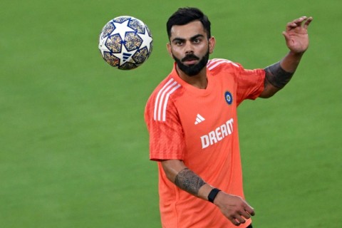 Different ball game: India's Virat Kohli takes part in a practice session 