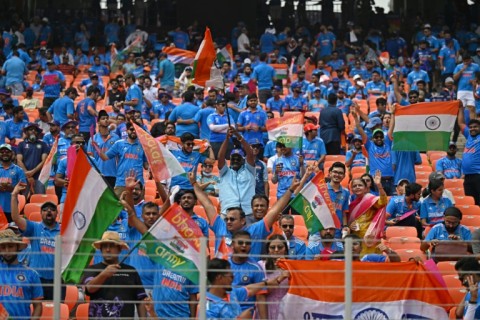 Sea of blue: India fans cheer before the start of the match on Saturday