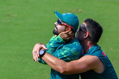 Get a grip: Pakistan captain Babar Azam (left) warms up before a practice session on Friday